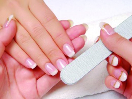 Studio nail   beautician polishing female nails