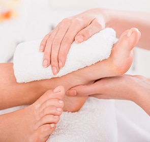 Close-up of relaxation pedicure process in spa salon.